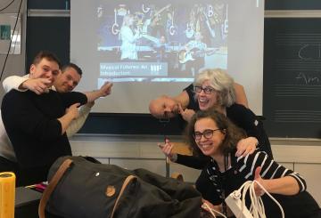 Inter-Country grantee Lorrie Heagy on her visit to Finland with new colleagues laughing after a workshop