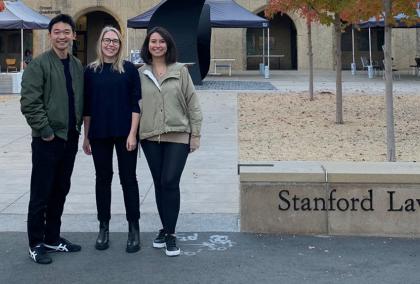 Sonja Heiskala with Kohei Wachi and Dilsad Saglam in front of Stanford Law School campus on a fall day