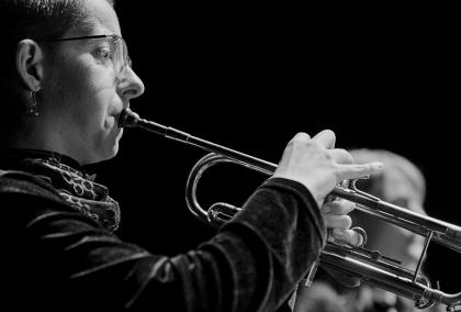 Black and white photo of Devina Boughton playing the trumpet