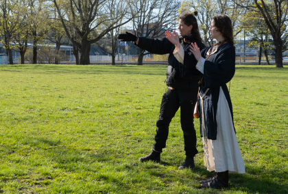 Madison McClintock directing a person between takes during a documentary film shoot