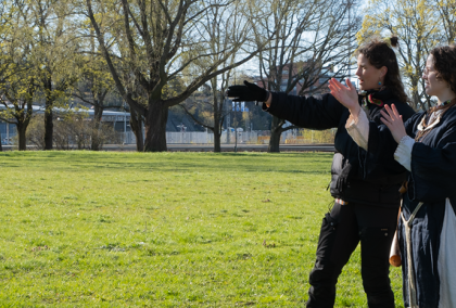 Madison McClintock directing a person between takes during a documentary film shoot
