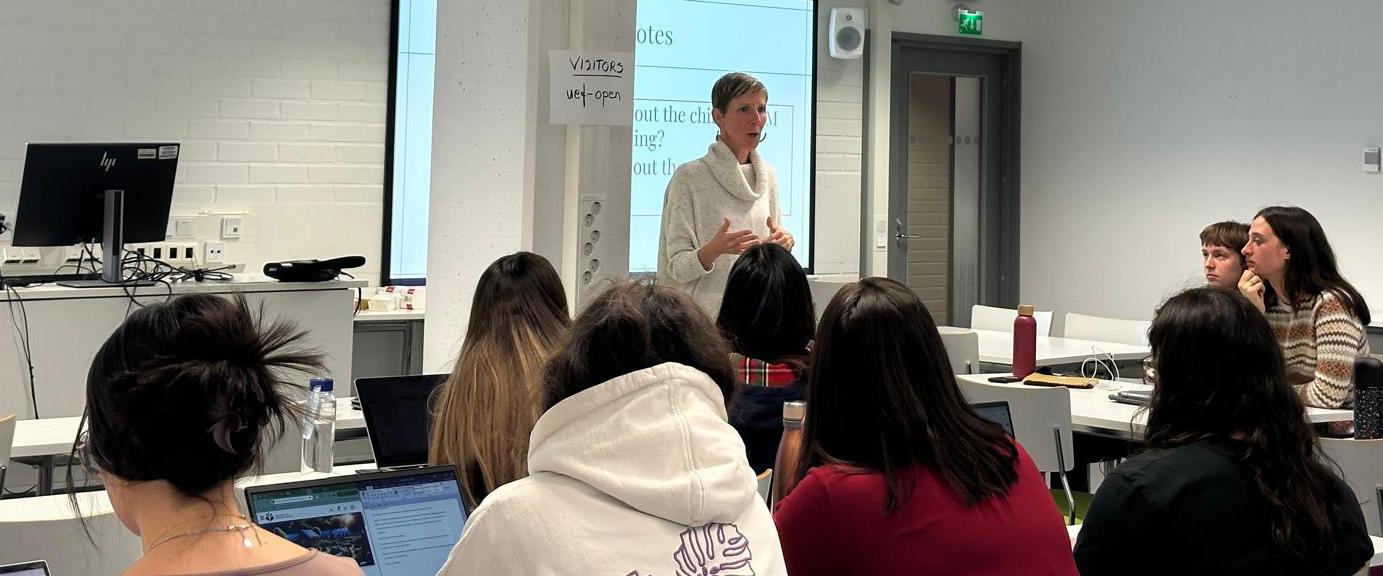 Amber Simpson giving a lecture to university students