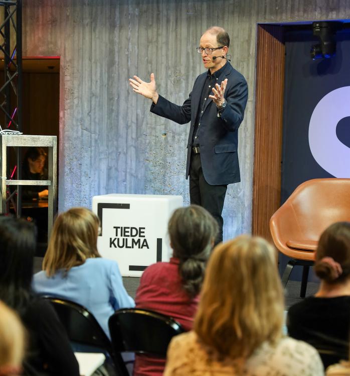 Joshua Wilson giving a public talk at Think Corner Stage