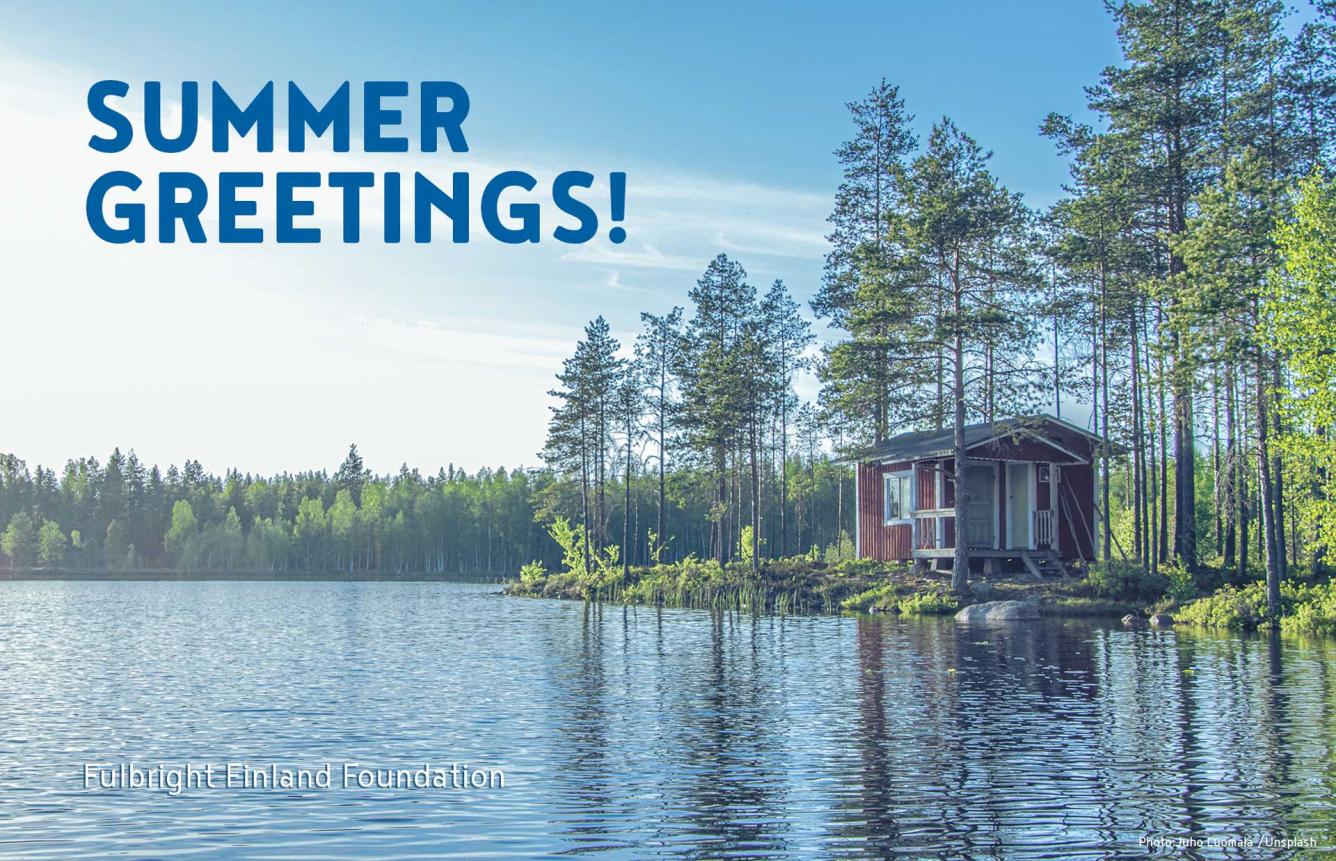 A red summer house on a lake with text "Summer Greetings!" and "Fulbright Finland Foundation" written on it. Photo: Juho Luomala / Unsplash