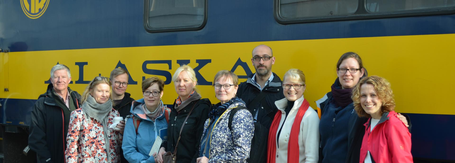 Towards Sustainable Arctic Futures study tour participants in front of Aurora Winter Train from Anchorage to Healy, Alaska