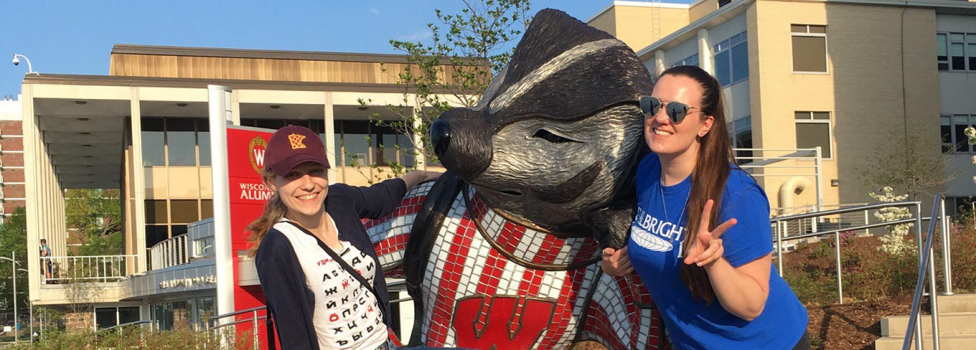 Finnish Language and Culture Teaching Assistant fellows with the university mascot