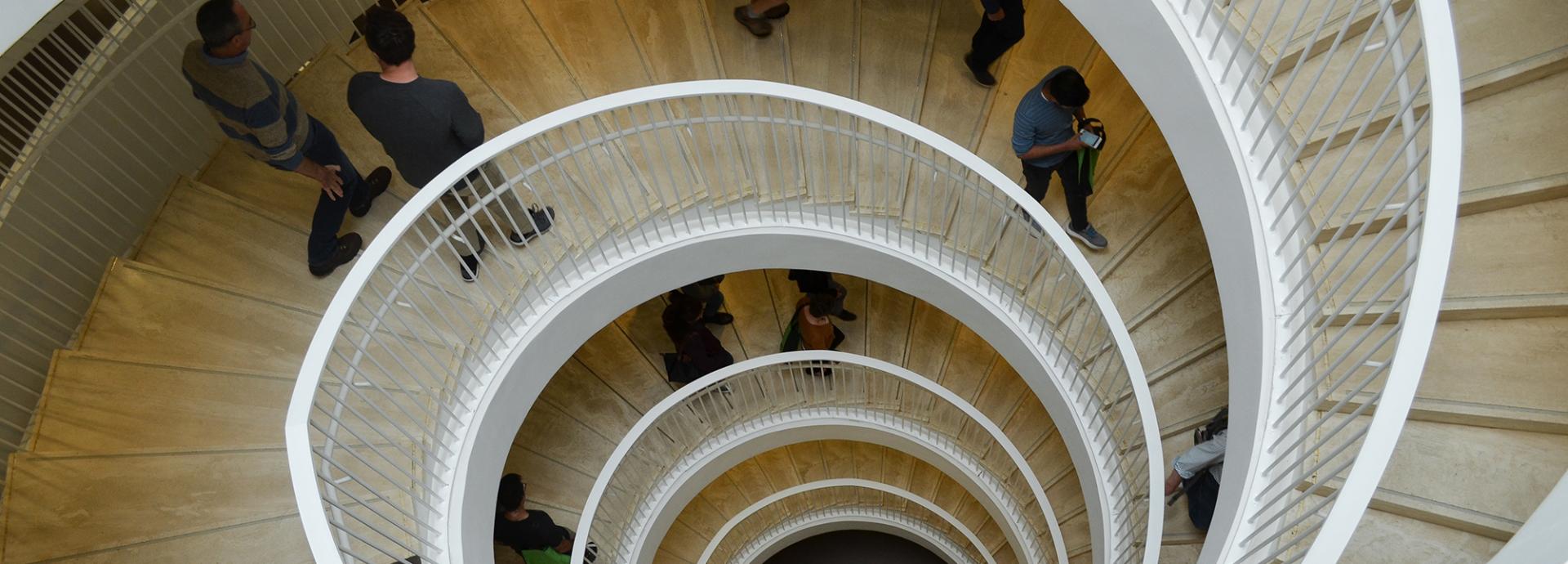 People walking down the stairs at the University of Helsinki library