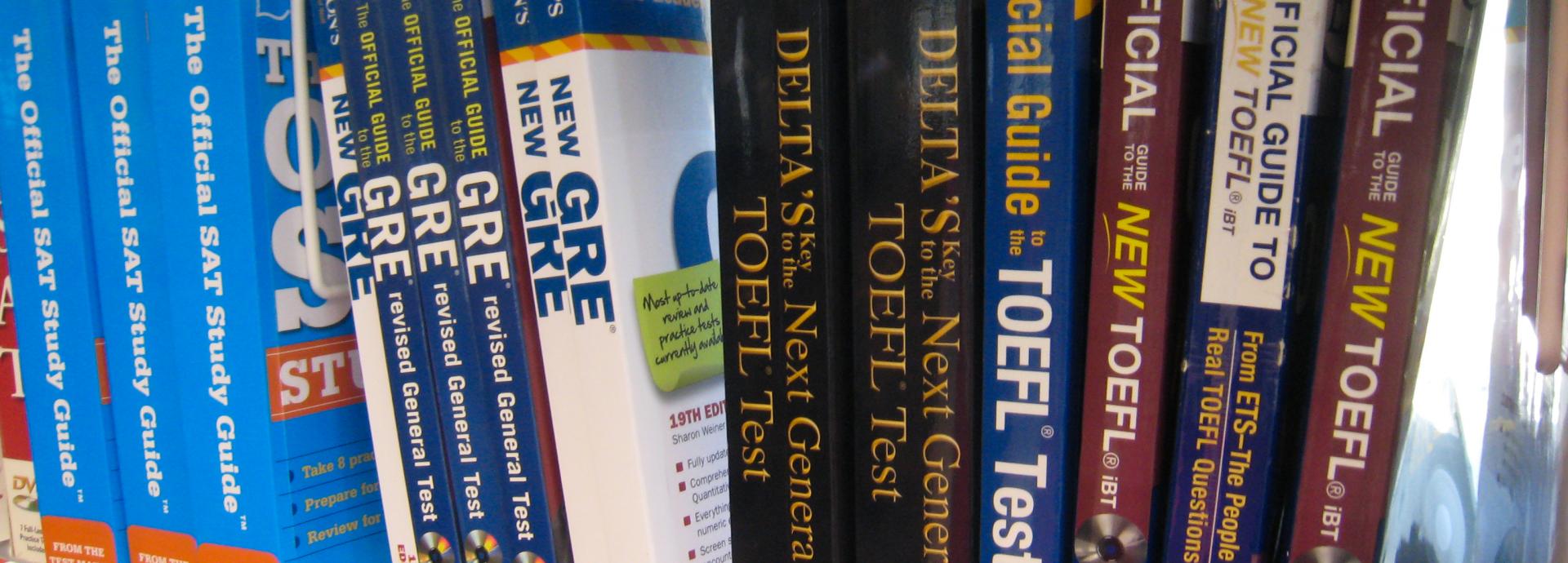 Test practice books on a shelf in a row