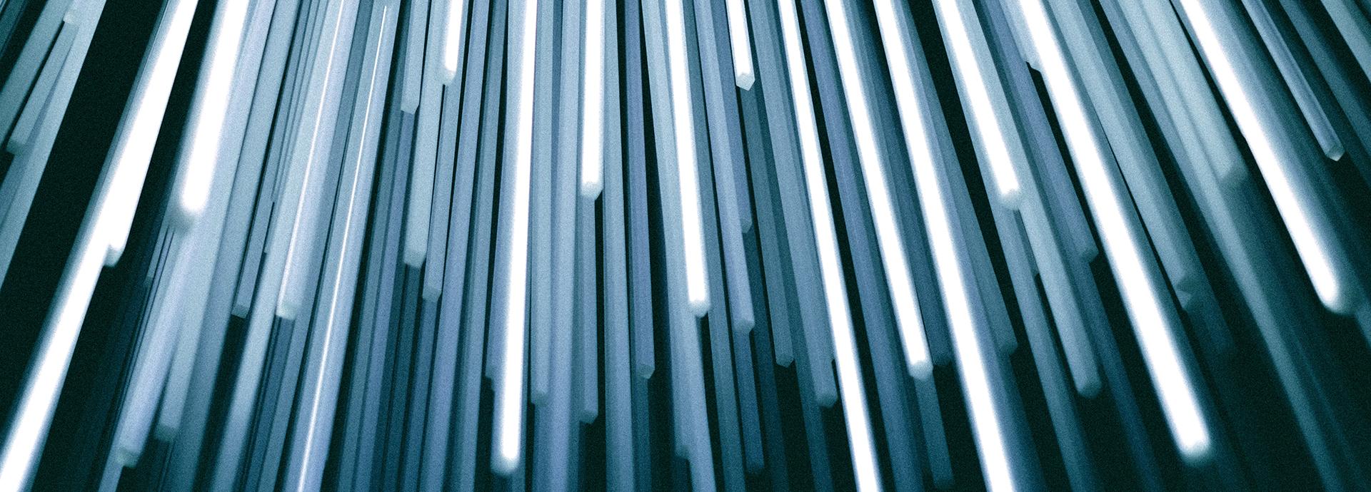 Abstract photo of light beams coming from the top of the photo towards the photo.