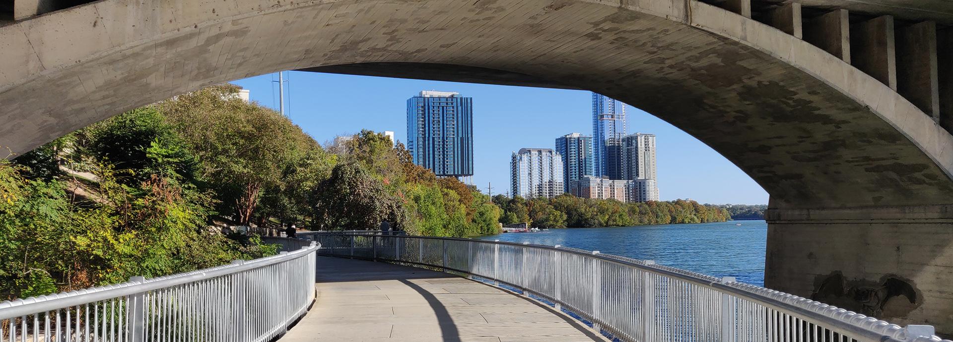 A view of skyline of Austin, Texas. The photo is taken under a bridge.