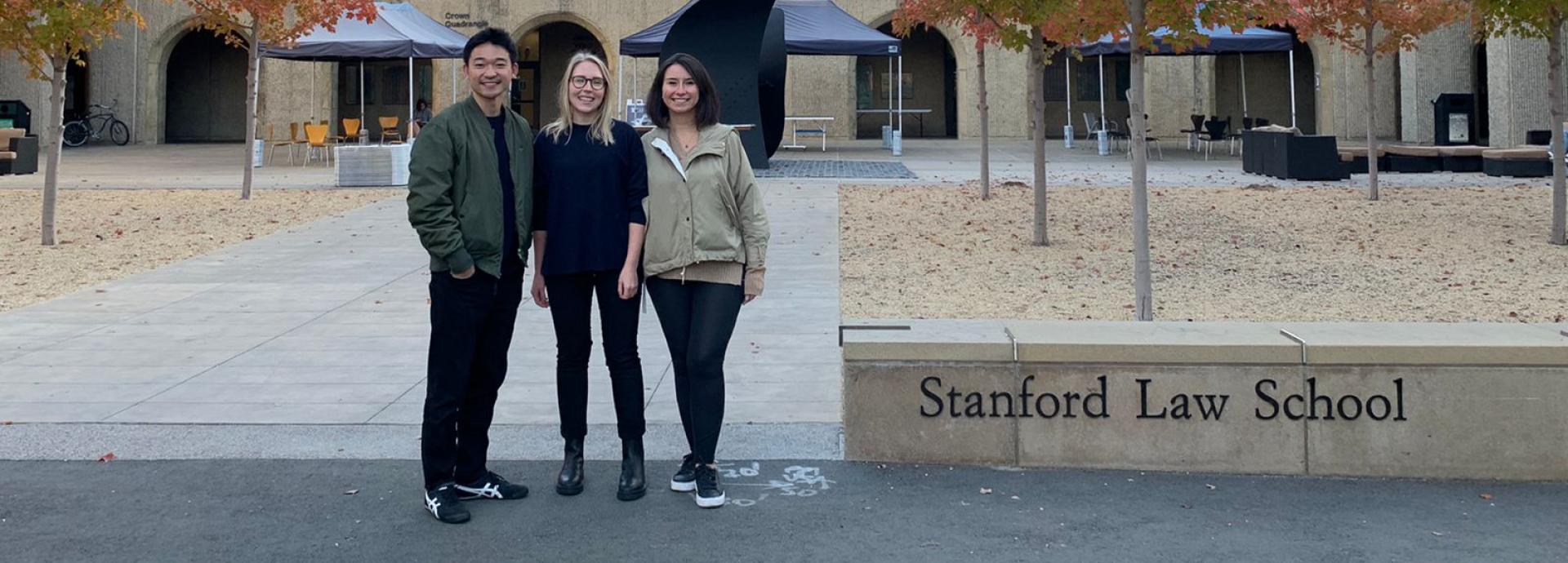 Sonja Heiskala with Kohei Wachi and Dilsad Saglam in front of Stanford Law School campus on a fall day