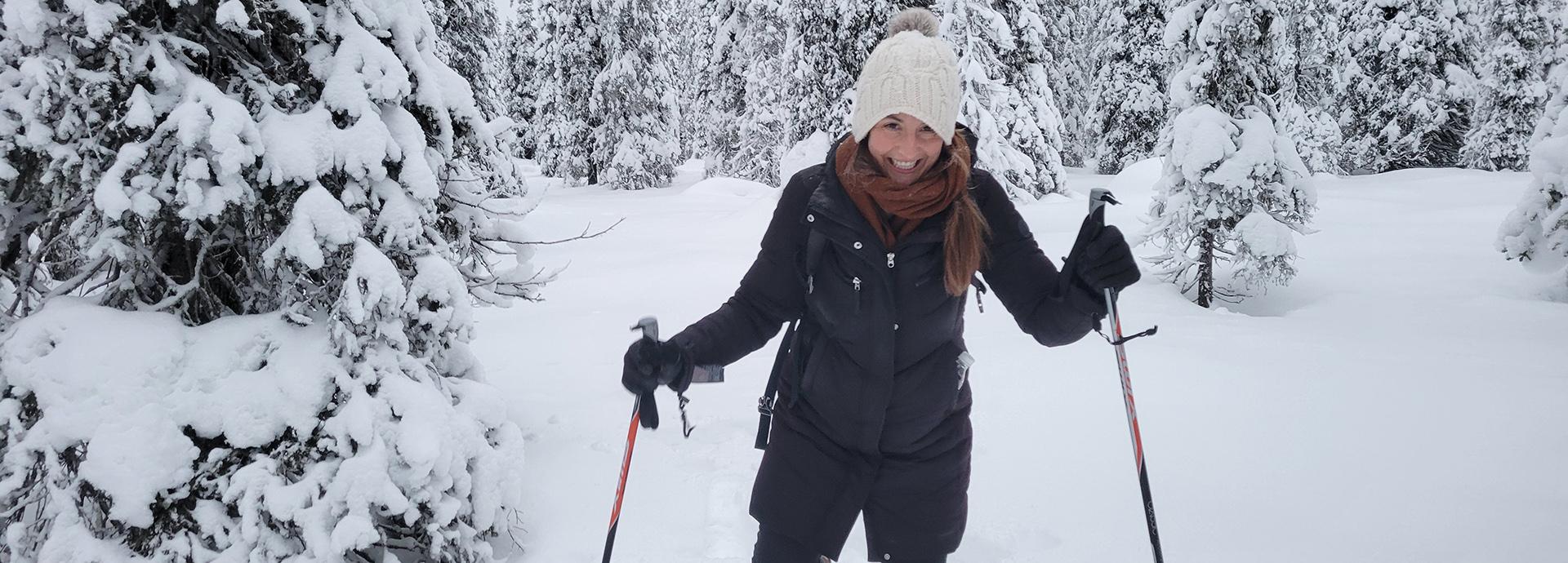 Kathryn Picardo snow-shoeing in a snowy forest