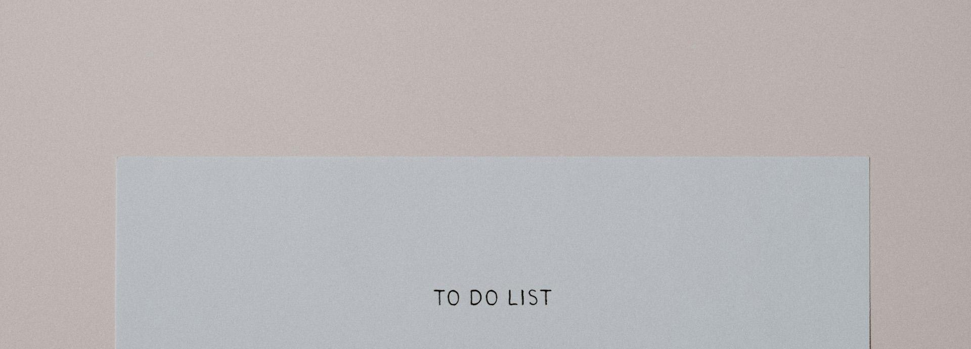 A piece of paper with the words TO DO LIST at the top of it