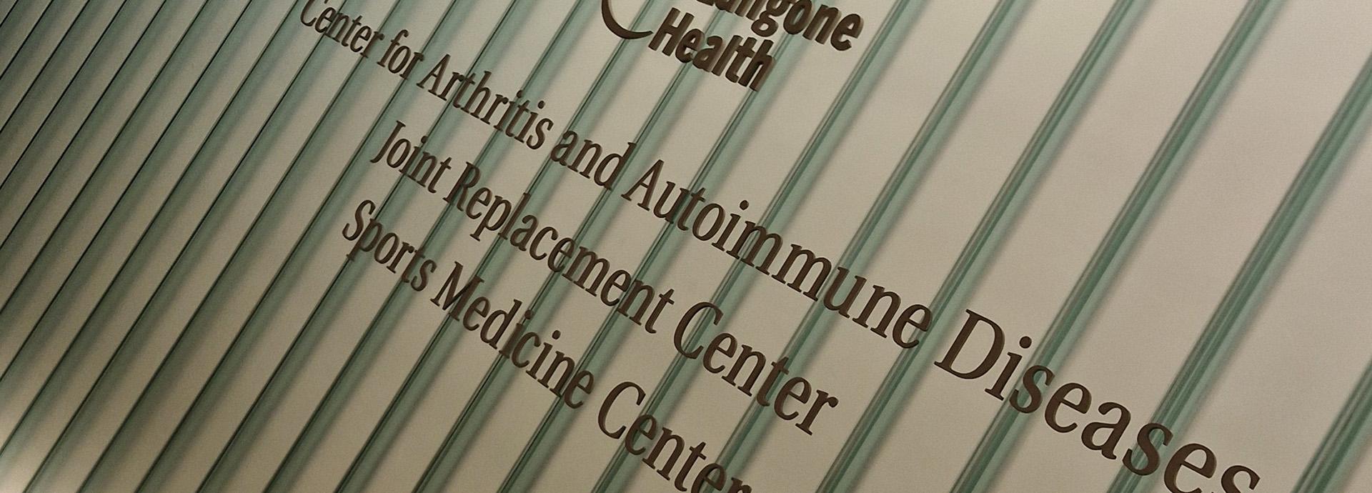 Sign of the NYU Langone Health's Center for Arthritis and Autoimmune Diseases, Joint Replacement Center, and Sports Medicine Center