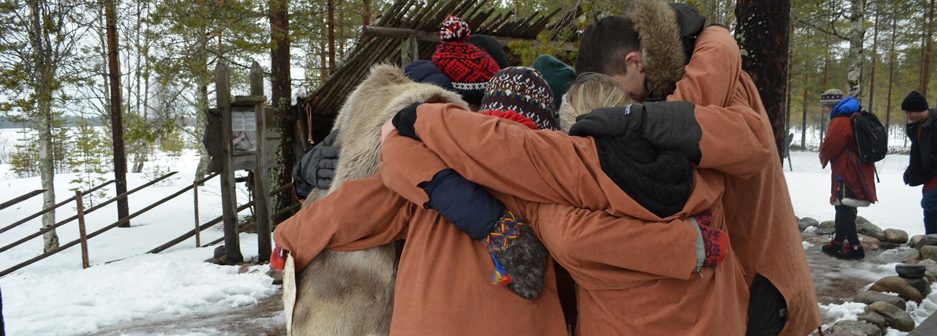 Group of people hugging each other