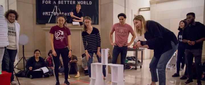 ASLA-Fulbright Pre-doctoral grantee Antti Surma-aho observing students at an engineering class at MIT. The six students are testing a device they built.