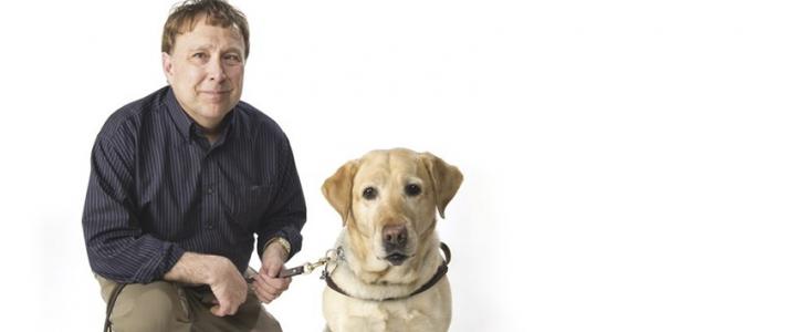 Poet, disability advocate and Fulbright Finland alumnus Stephen Kuusisto with his guide dog, a labrador retriever