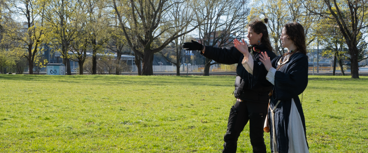 Madison McClintock directing a person between takes during a documentary film shoot