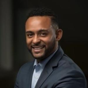 Photo of a man smiling at the camera