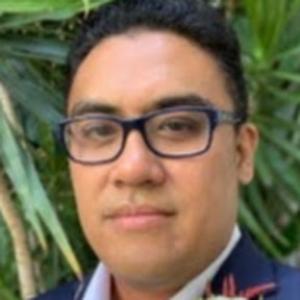 A person in a suit and glasses