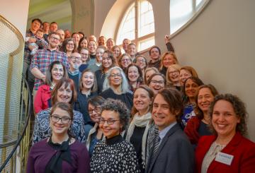 American Fulbrighters standing on a staircase 