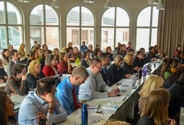 Audience at the Fulbright Forum 2019 smiling and listening to a presentations